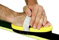 Brush off excess wax after scraping your skis or snowboards.